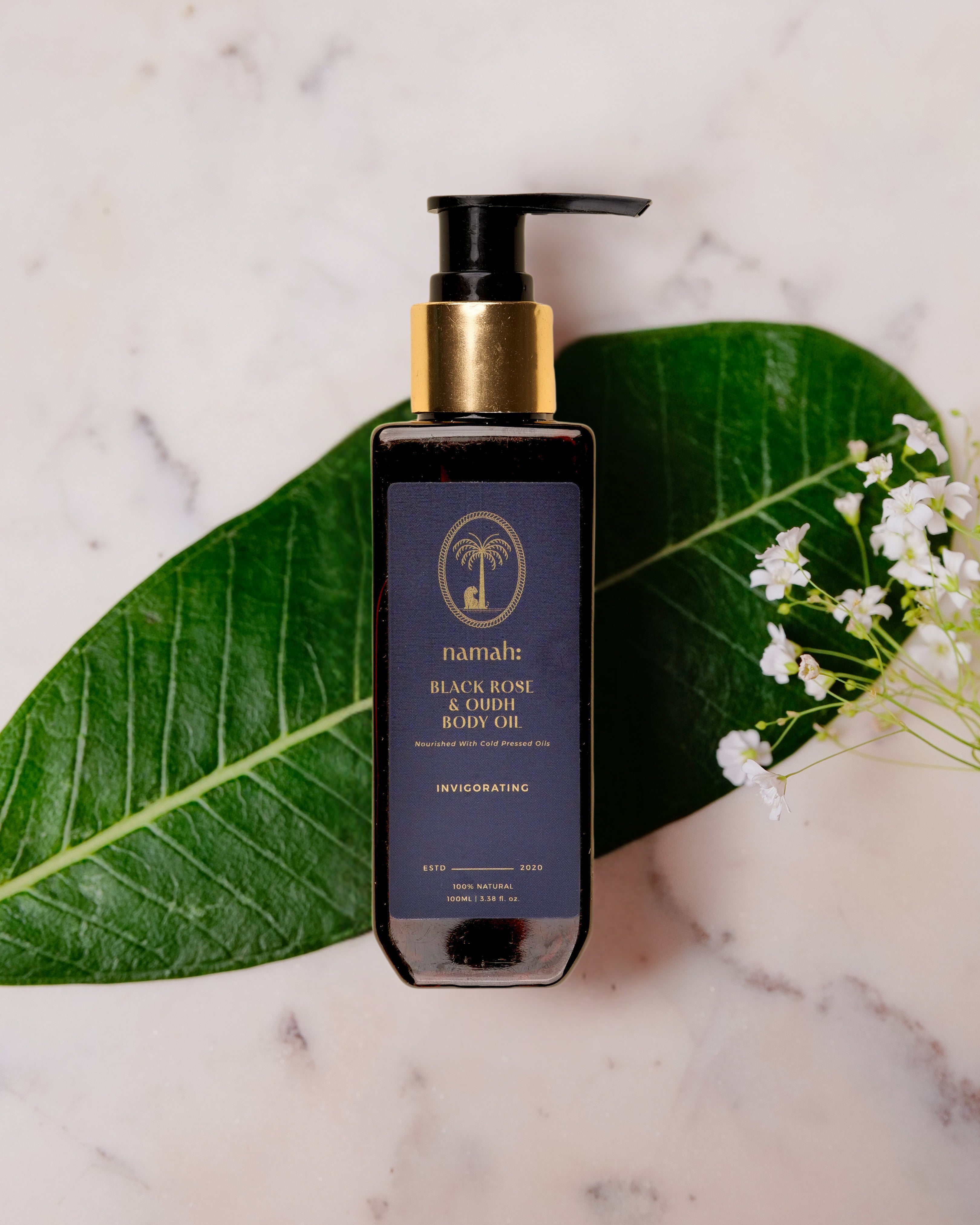 Black Rose & Oudh Body Oil, Top View, Palm Leaf Background