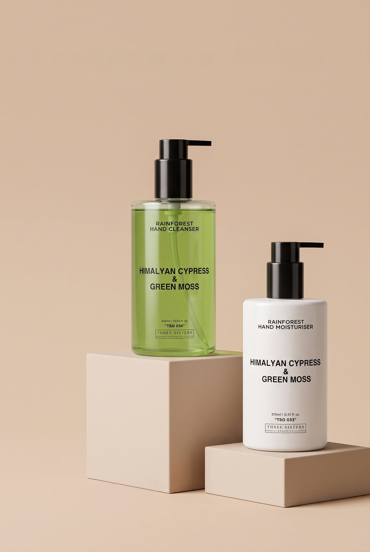 Two bottles of Himalyan Cypress & Green Moss Hand Wash and Cream on a soft beige background