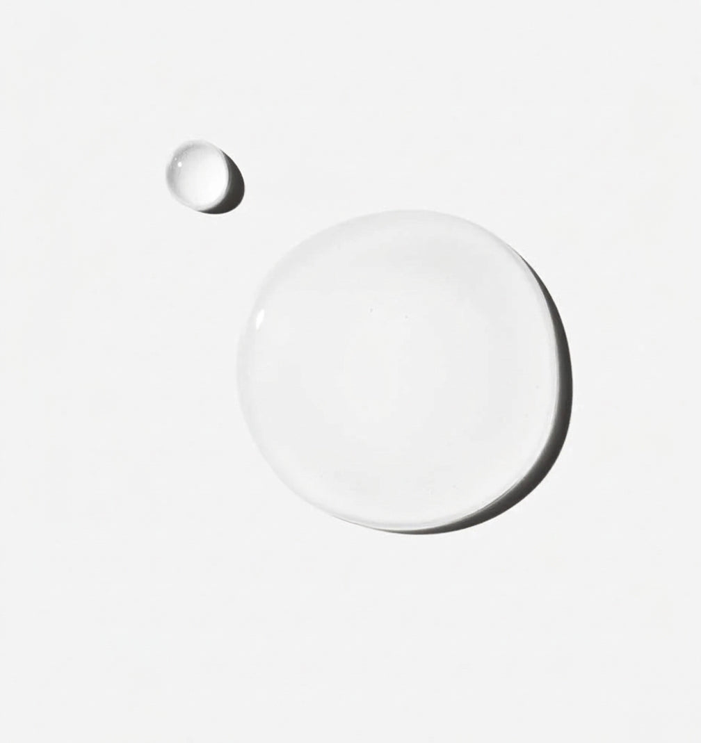 transparent serum droplets on a white background