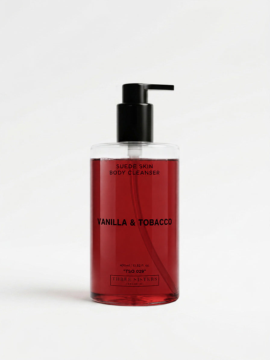 Red body cleanser bottle with black pump and 'Vanilla & Tobacco' text on a white background