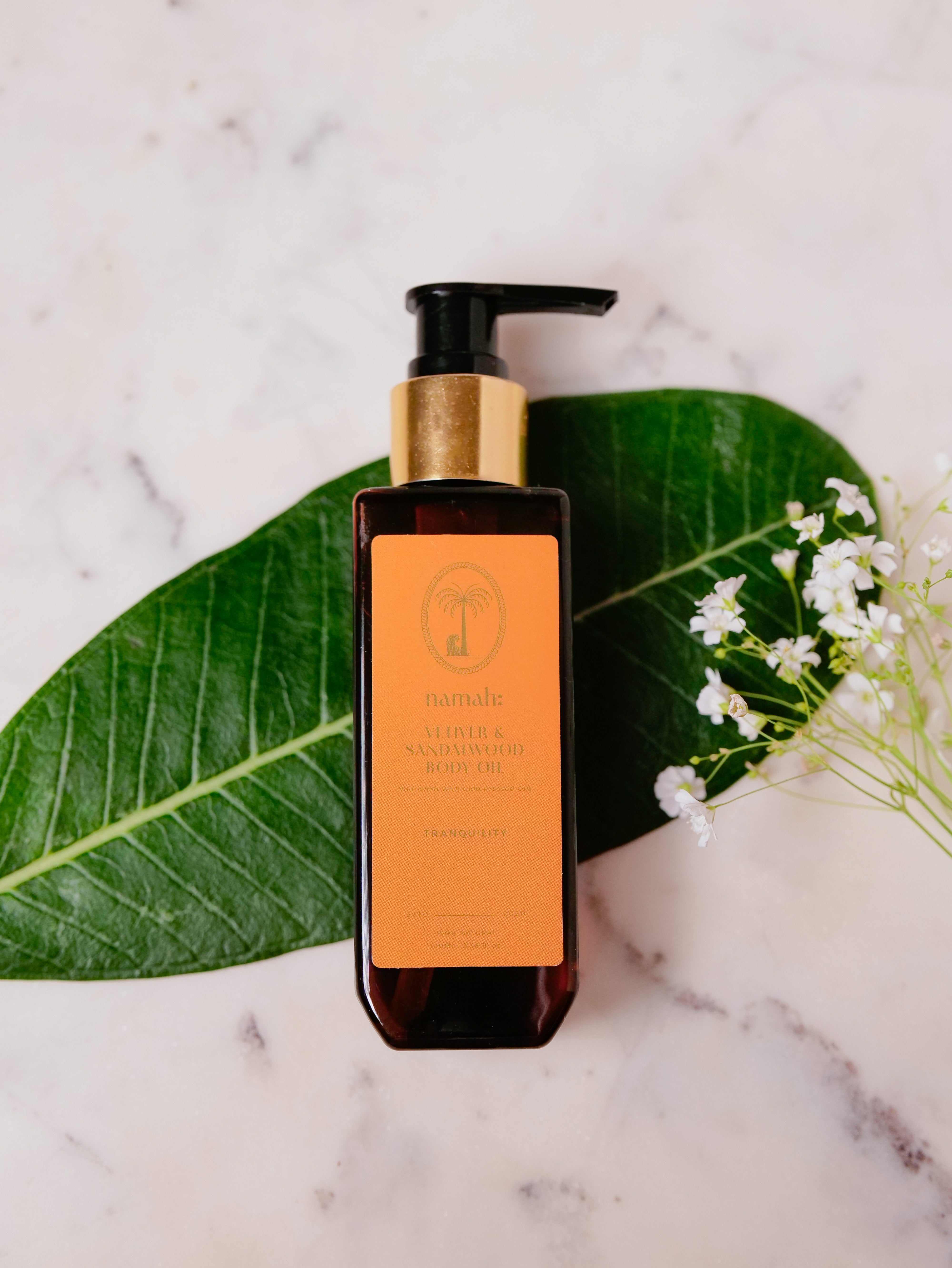 Vetiver & Sandalwood Body Oil, Top View, Palm Leaf Background