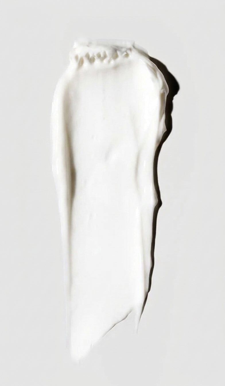 White cream spread with a shadow on a light grey background
