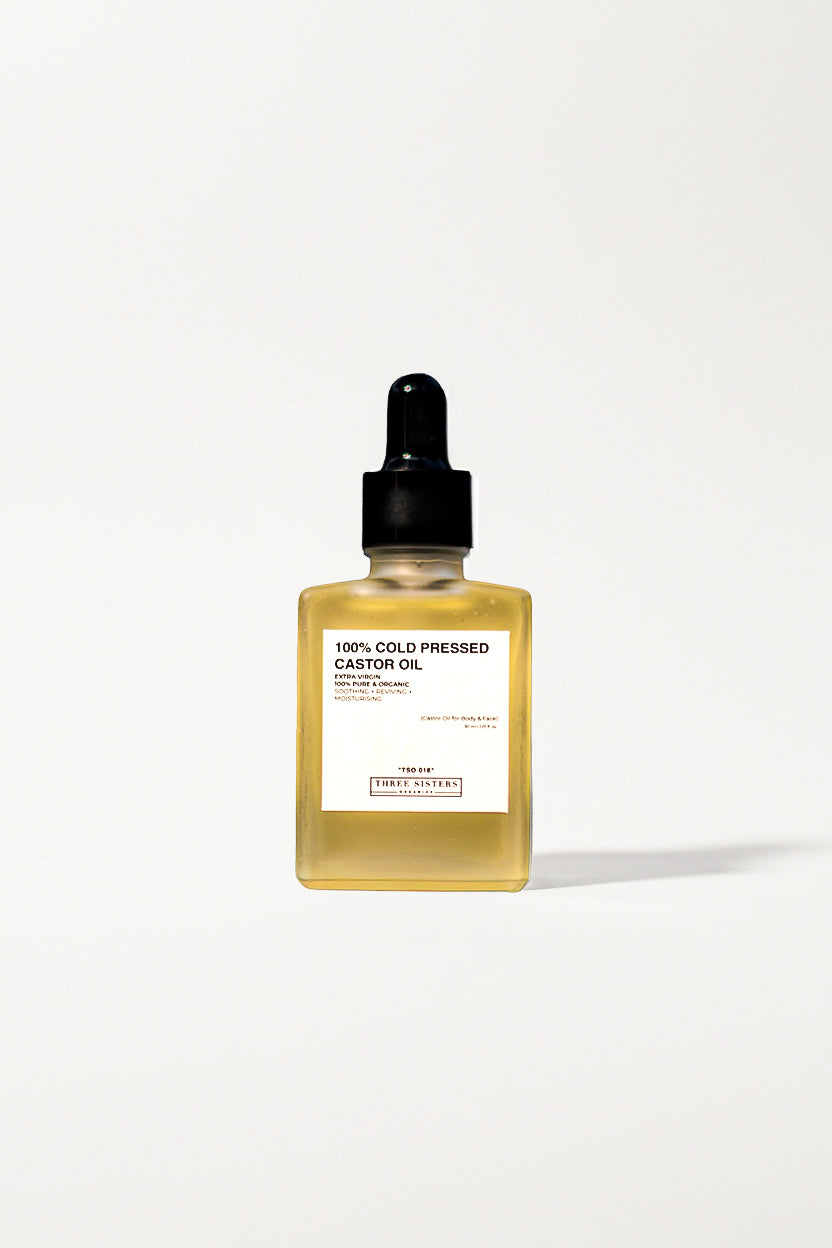 Bottle of 100% Cold Pressed Castor Oil on a white background