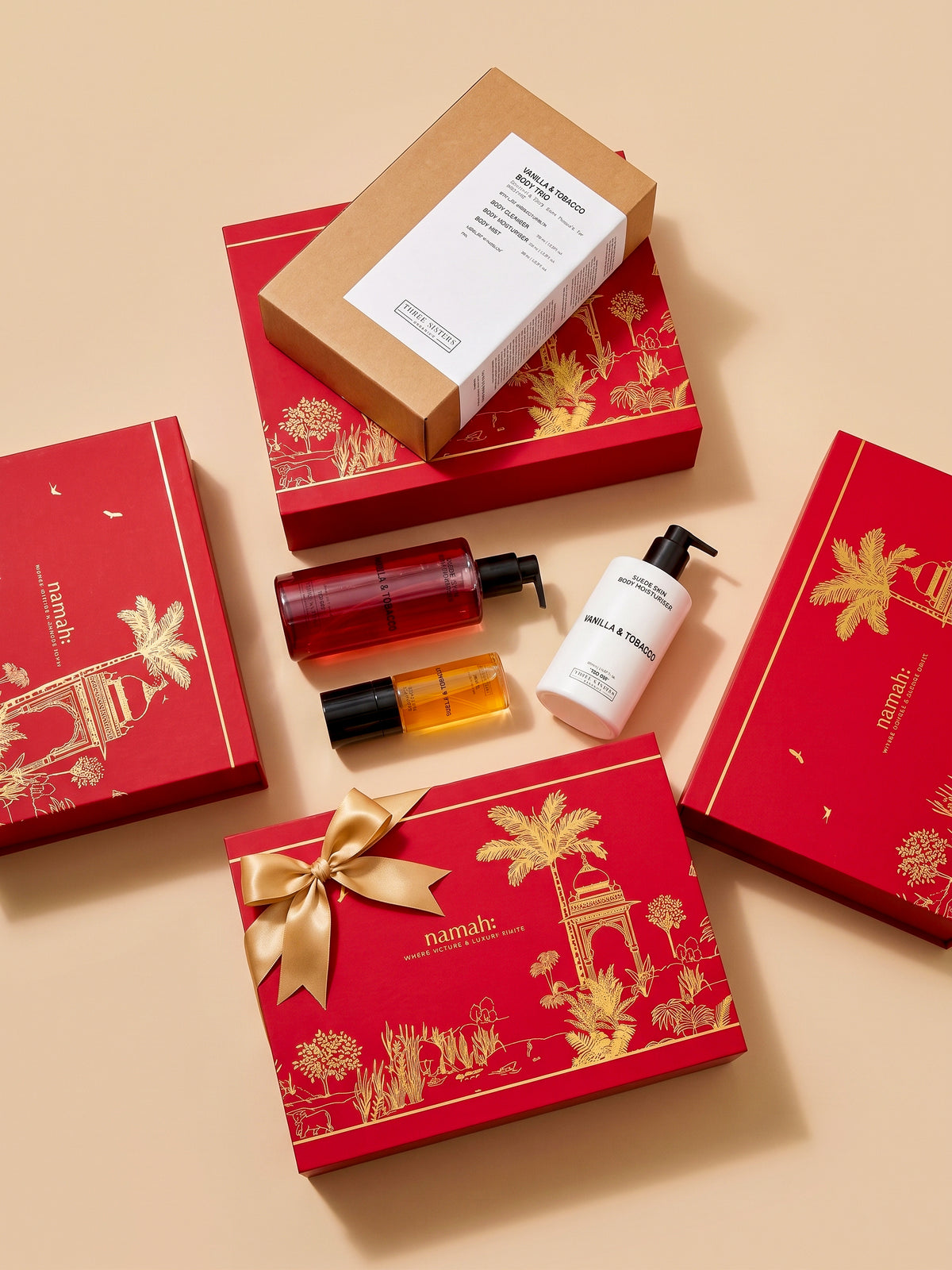 Three bottles of Vanilla & Tobacco Body Wash, Mist and Cream in a luxury gift box