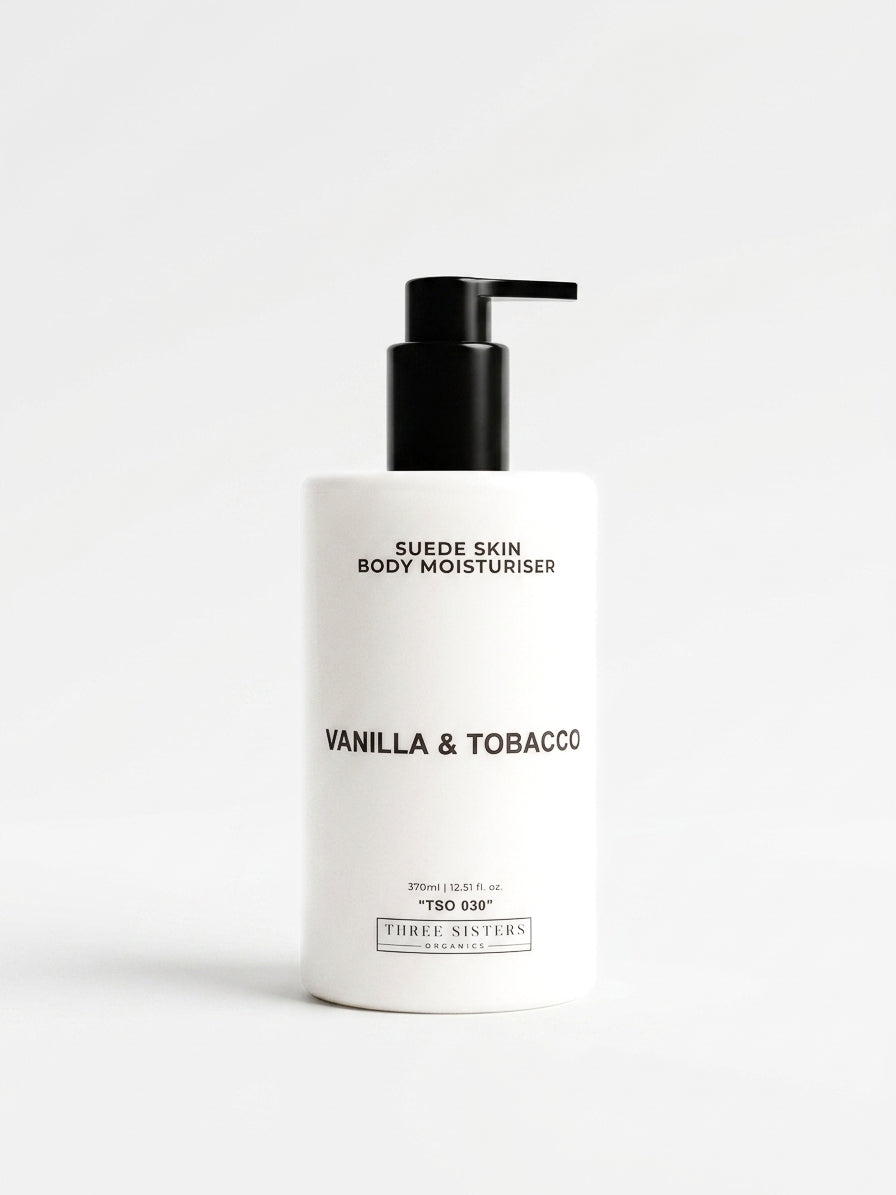 White body moisturizer bottle with black pump labeled 'Vanilla & Tobacco' on a white background